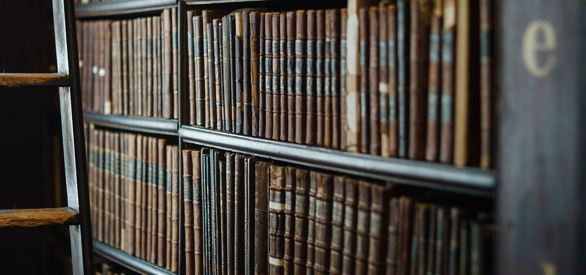 Bound volumes of Washington statutes on a law library shelf